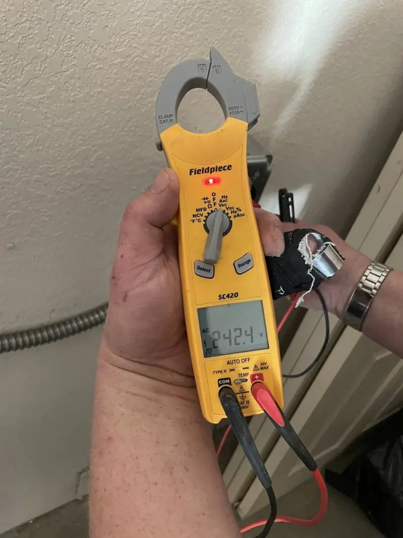Voltage testing with clamp meter during Circuit Breaker Repair in Clay